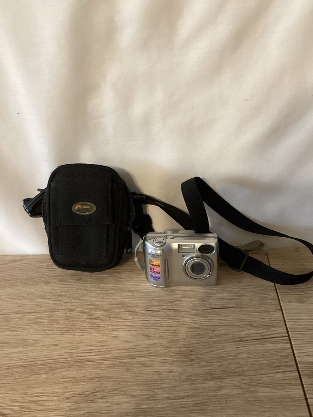 Nikon Silver Compact Digital Camera with Black Carrying Pouch
